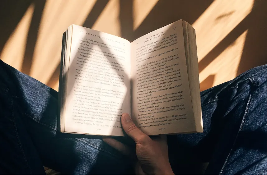 A book being proofread in someone's lap