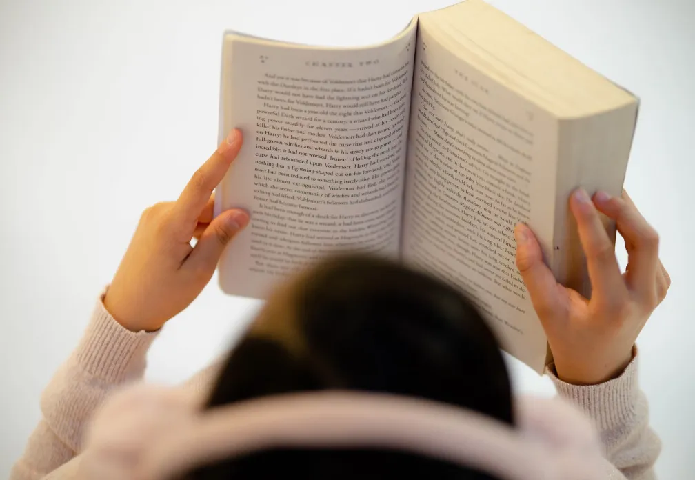 A woman reading an open book